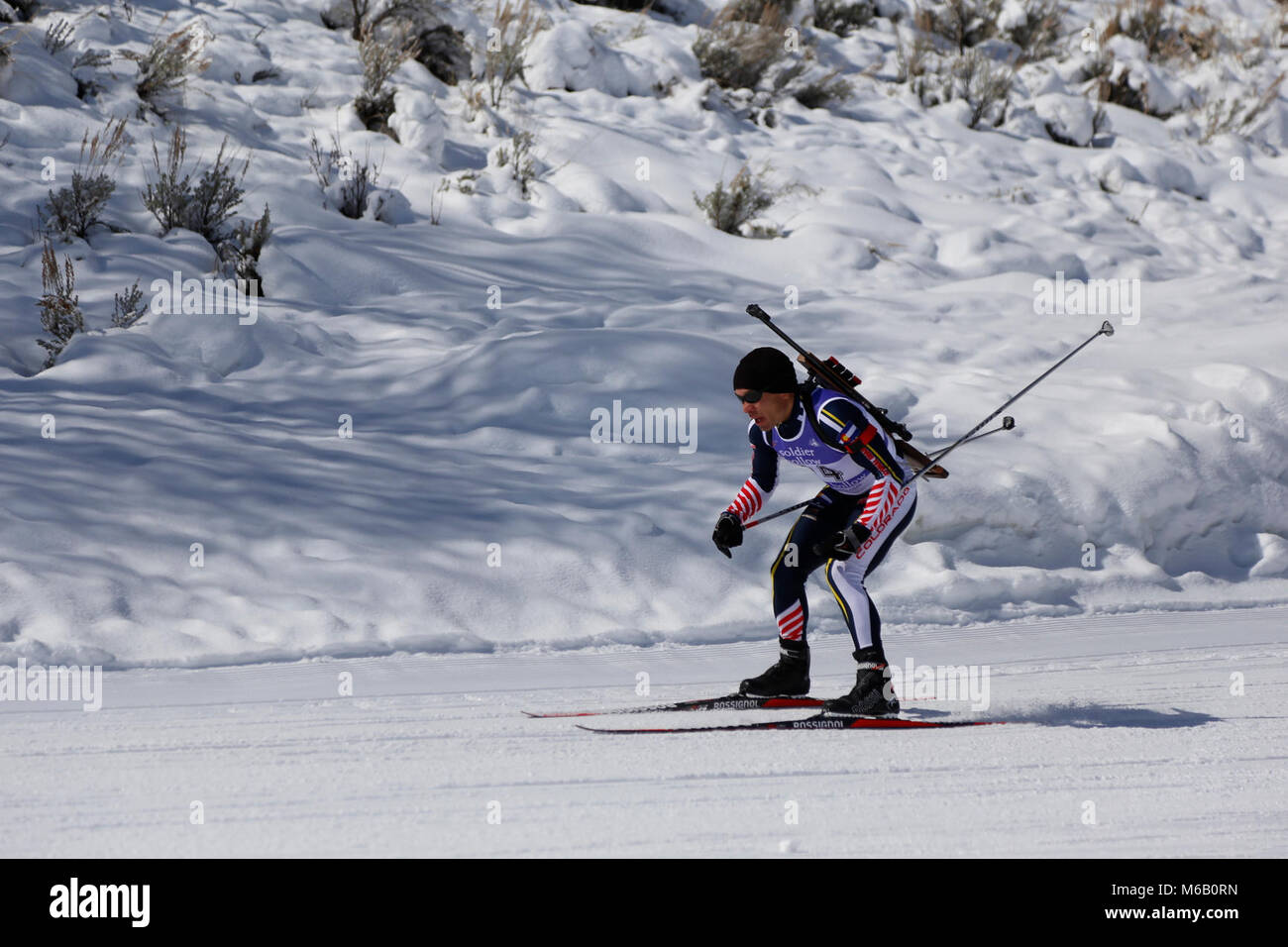 Sgt. Alfredo Varela of the Colorado National Guard digs deep to maintain momentum before heading into an uphill section of the Sprint race during the Chief National Guard Bureau Biathlon Championships at Soldier Hollow, Utah on Sunday, February 25th, 2018. National Guard members and civilians from 24 different states will participate in the 4-event compeition that concludes on Thursday, March 1st. Stock Photo