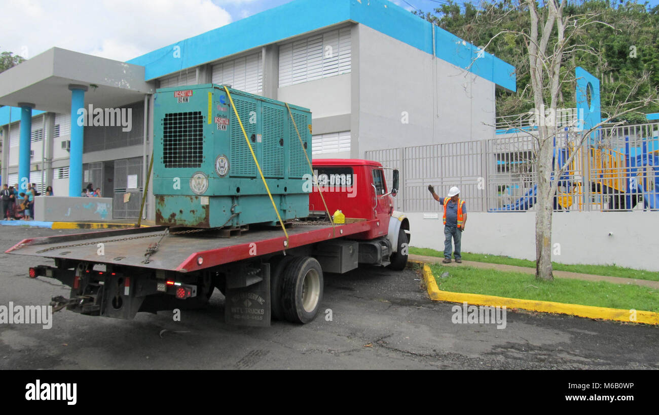 U.S. Army Corps of Engineers contractors arrive to install a temporary