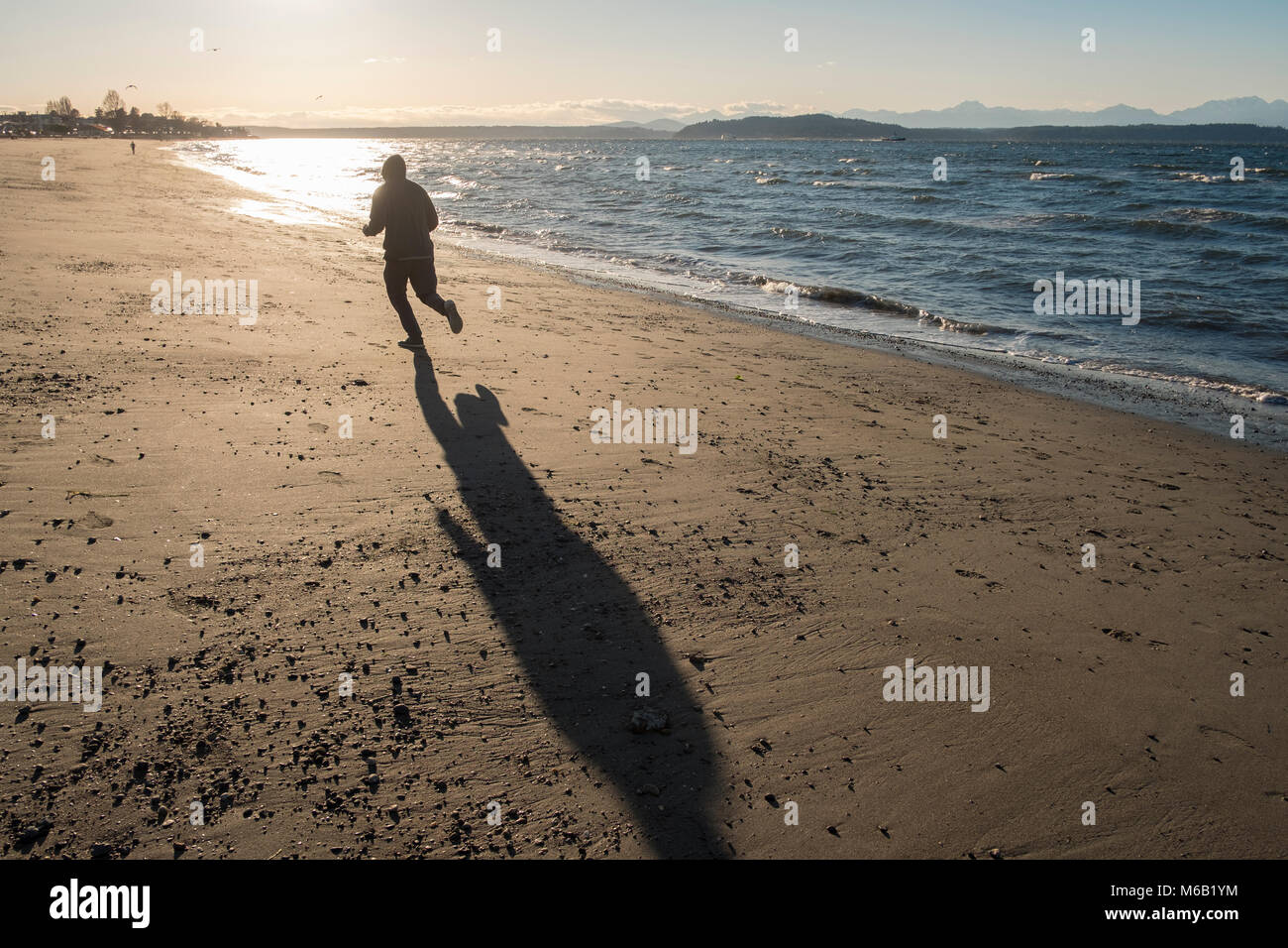 Running on Alki Beach, Seattle, Washington, USA Stock Photo
