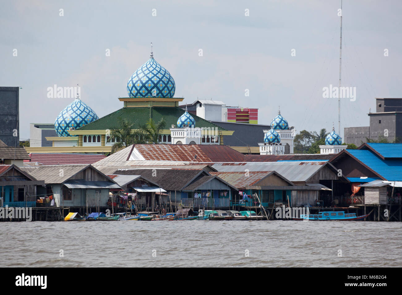 Kumai port and mosque on the Kumai River in central Kalminantan, Indonesian Borneo Stock Photo