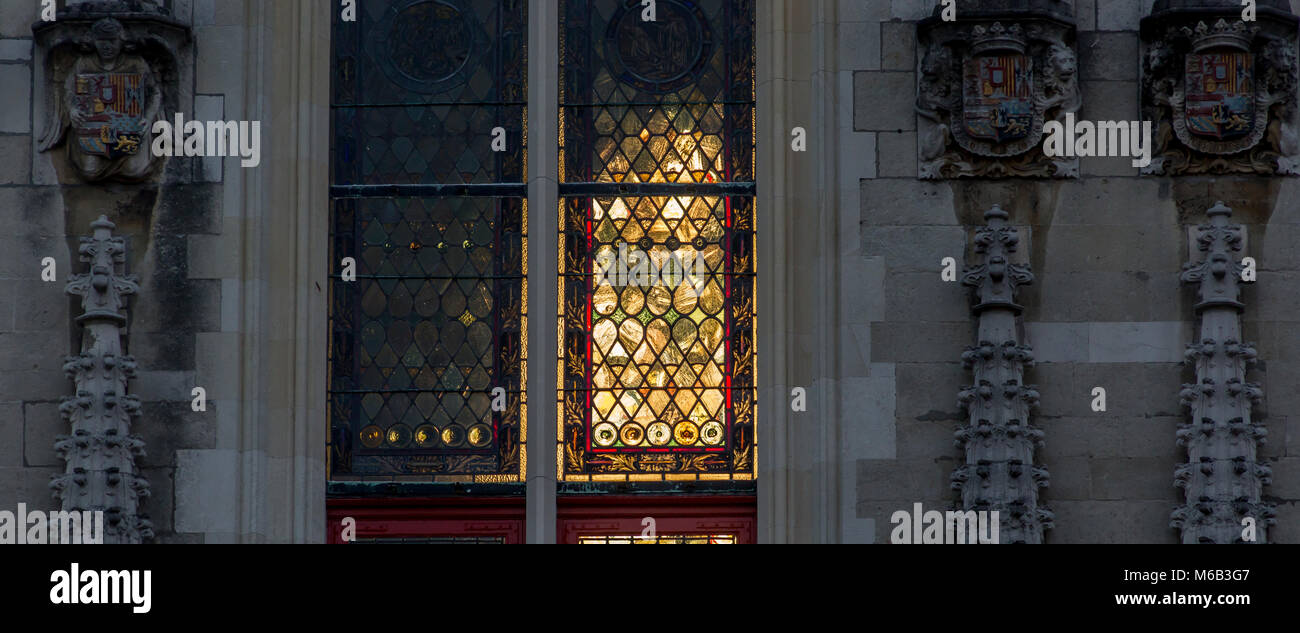 Sunlight through ancient Basilica of the Holy Blood windows in Bruges Stock Photo