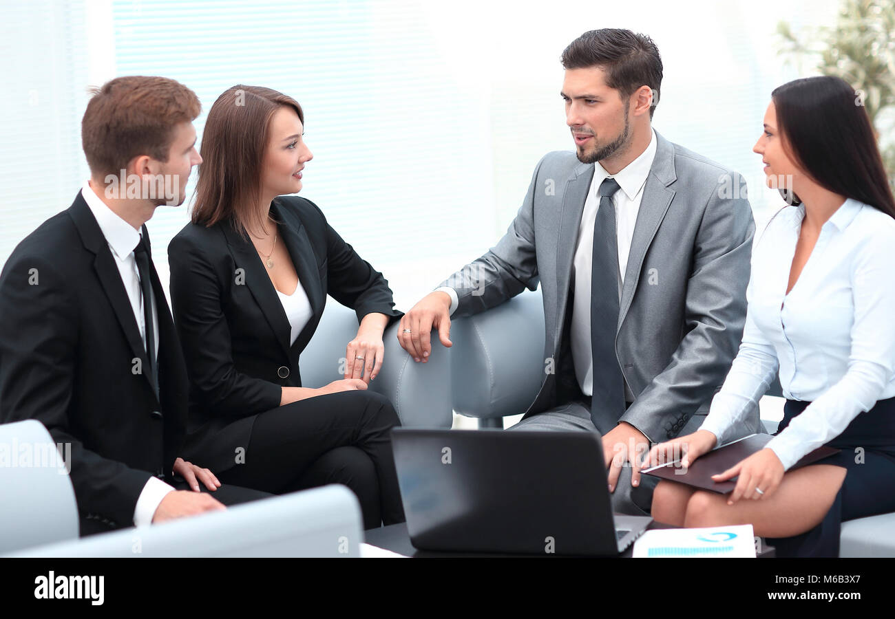 business team sitting in the lobby of the office Stock Photo - Alamy