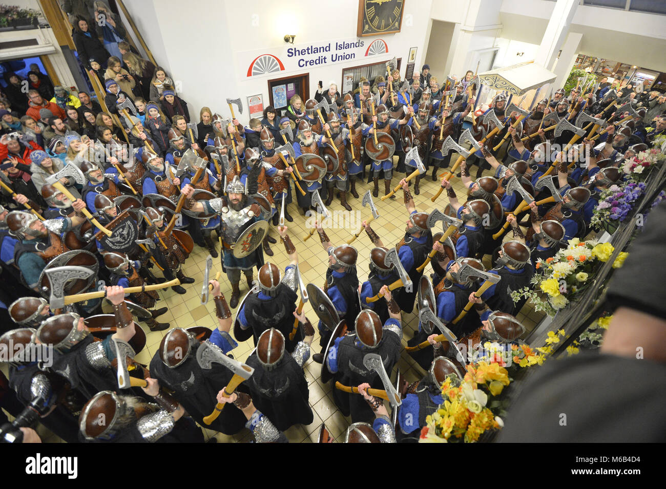 The squad sing songs inside Toll Clock Shopping Centre during the Up