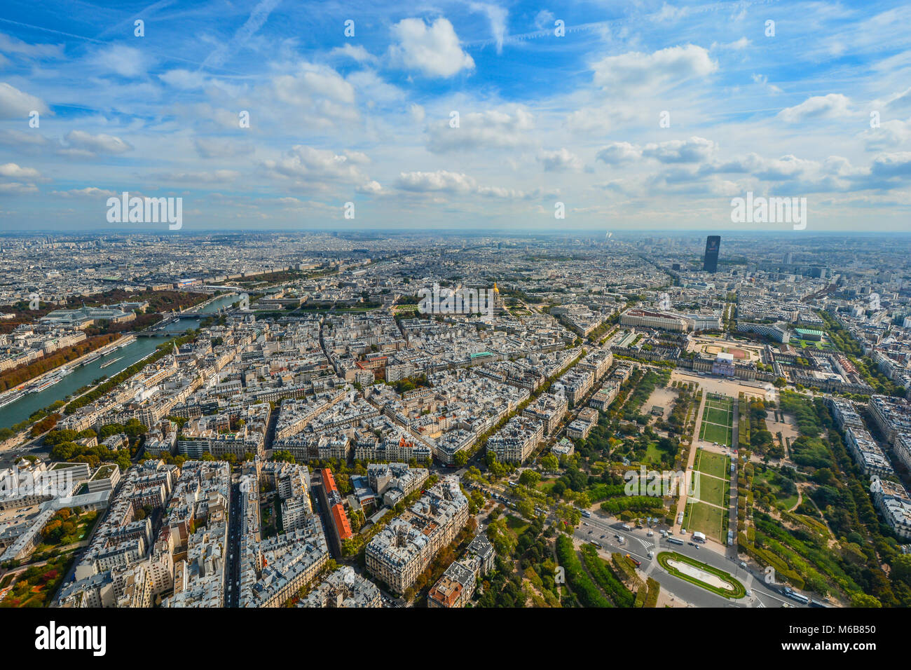 A view of Paris France from the Eiffel Tower in early autumn with the Seine, Champ du Mars, and Montparnasse Tower in view on a sunny day Stock Photo