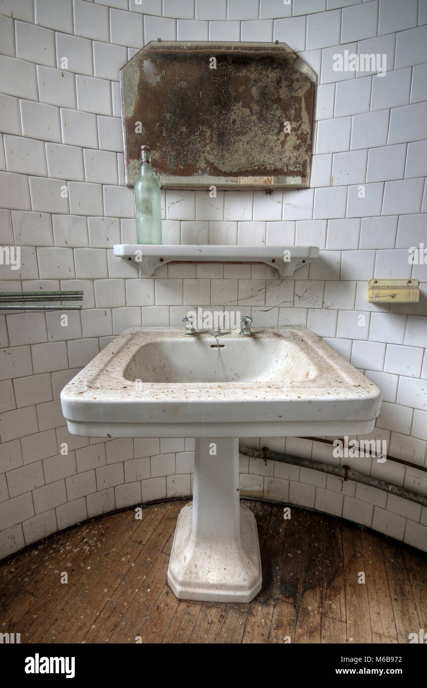 Dirty bathroom in an abandoned house Stock Photo