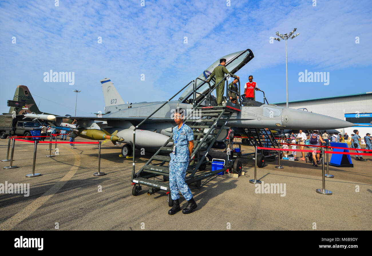 Singapore  - Feb 10, 2018. A Lockheed Martin F-16 Fighting Falcon aircraft belong to the Singapore Air Force with soldiers at the 2018 Singapore Airsh Stock Photo