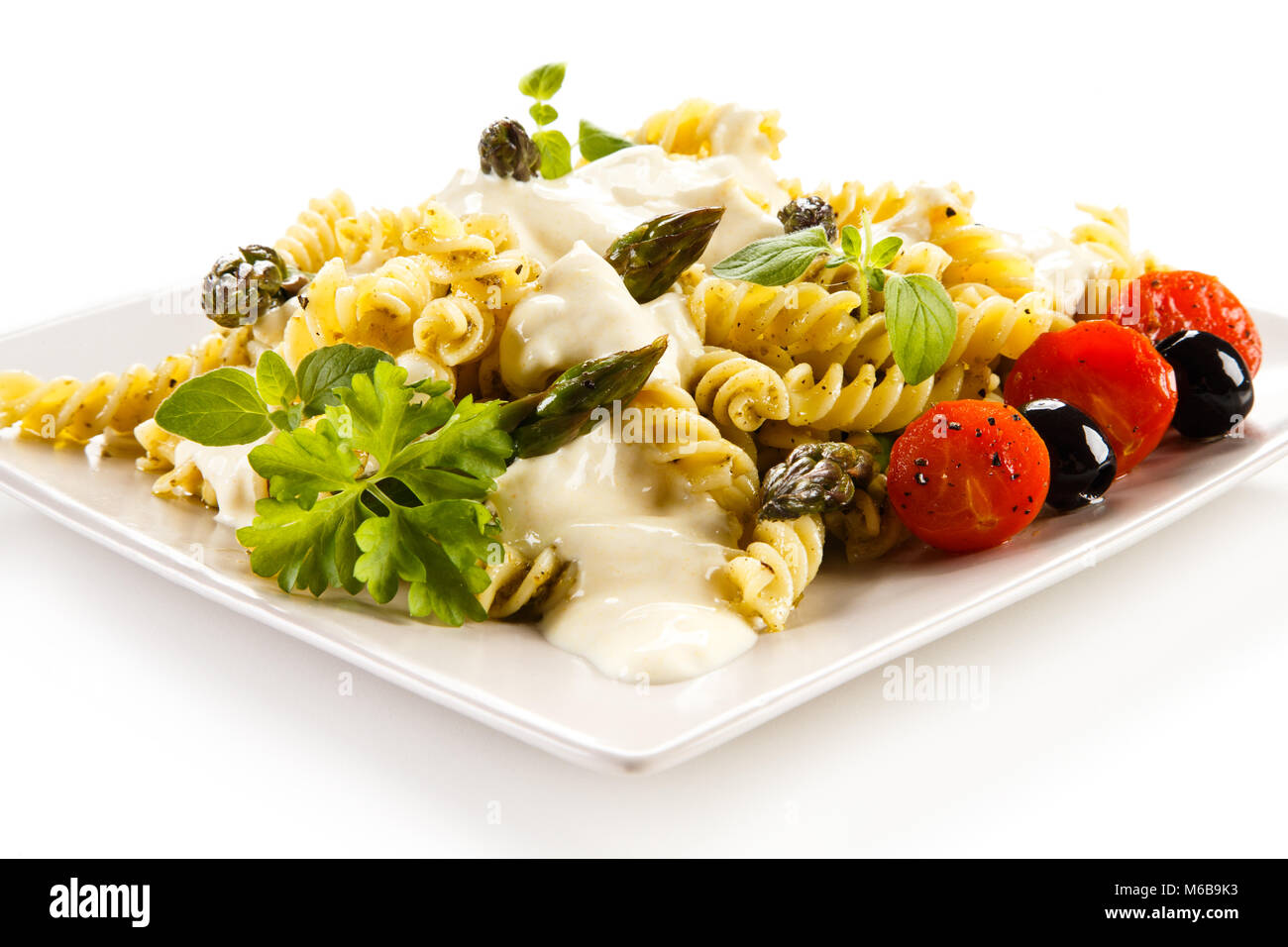 Pasta, white sauce and vegetables Stock Photo Alamy