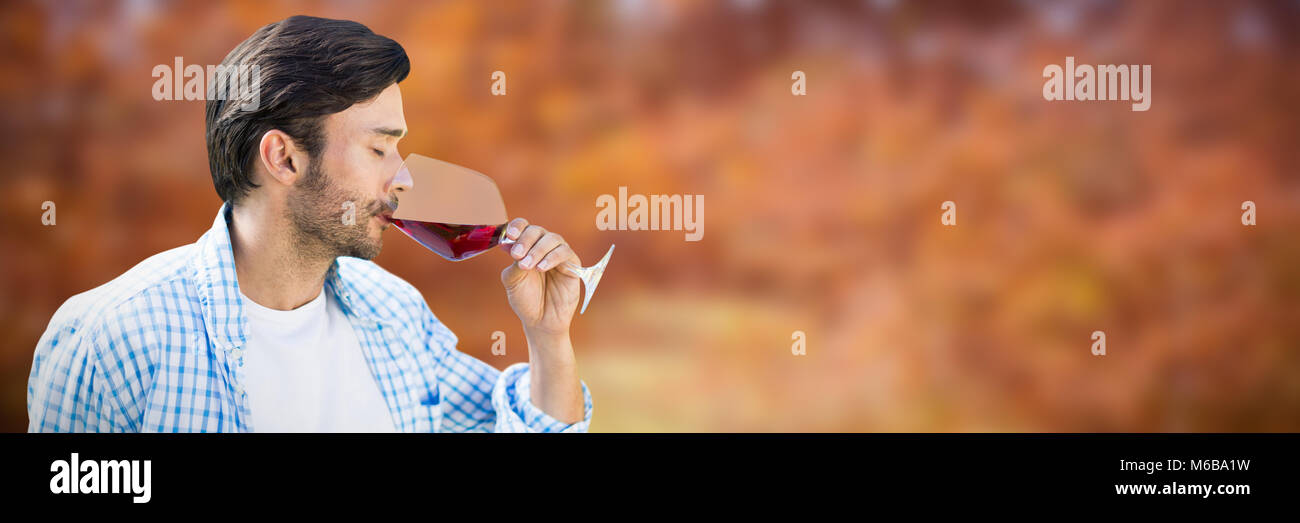 Composite image of man drinking red wine Stock Photo - Alamy