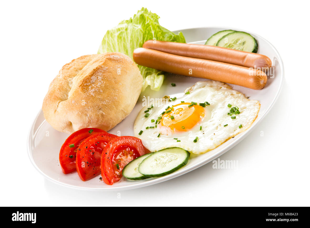 Breakfast - fried egg and sausages Stock Photo