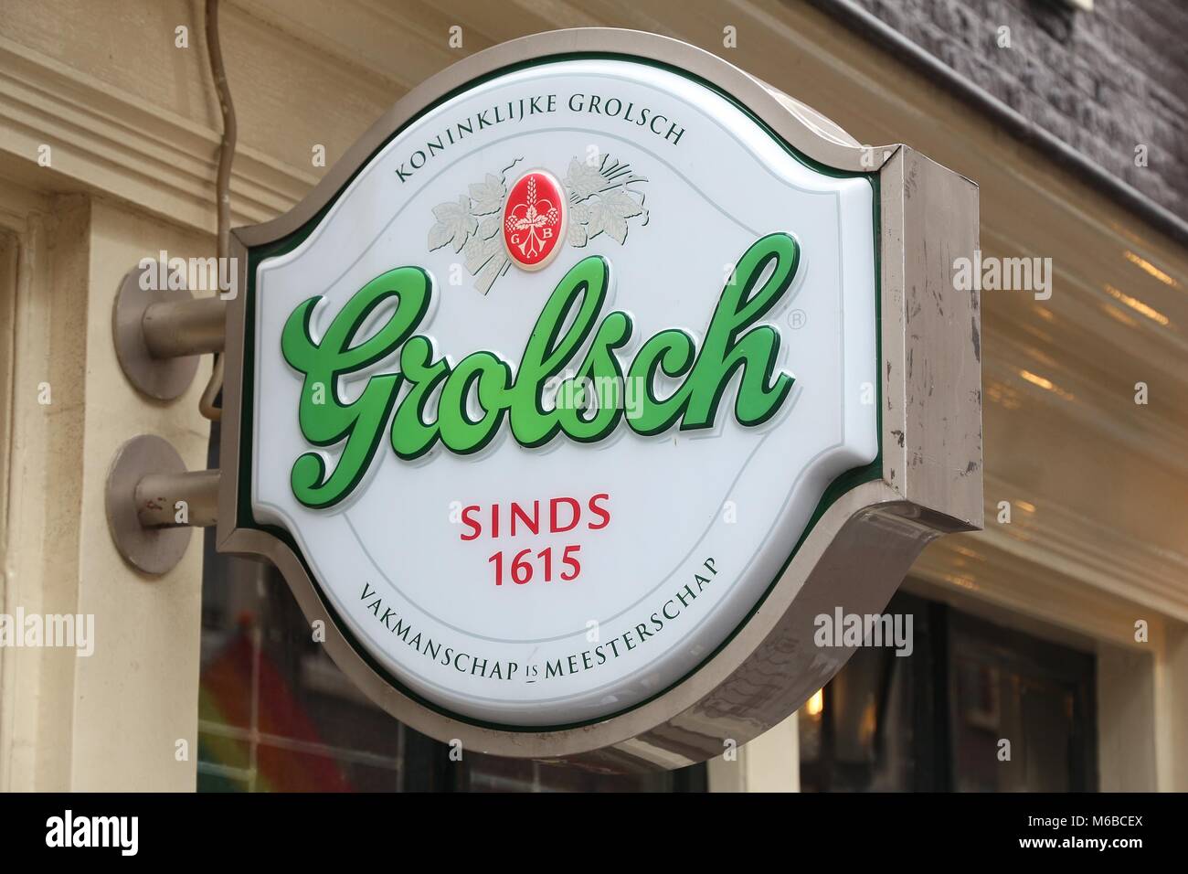 AMSTERDAM, NETHERLANDS - JULY 8, 2017: Grolsch beer sign in Amsterdam, Netherlands. Grolsch is a Dutch brewery founded in 1615. Stock Photo
