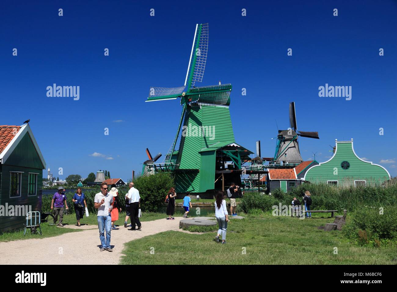 ZAANSE SCHANS, NETHERLANDS - JULY 9, 2017: People visit Zaanse Schans restored village in the Netherlands. The popular tourist attraction had 1.6 mill Stock Photo