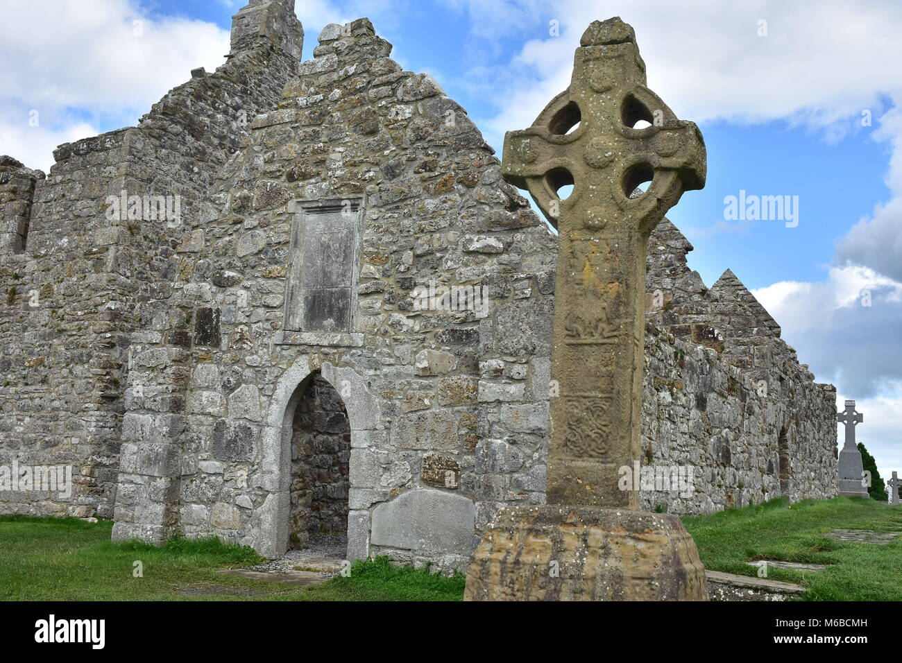Replica of original 9th century sandstone high cross called South Cross on grounds of monastery of Clonmacnoise in Ireland. Stock Photo