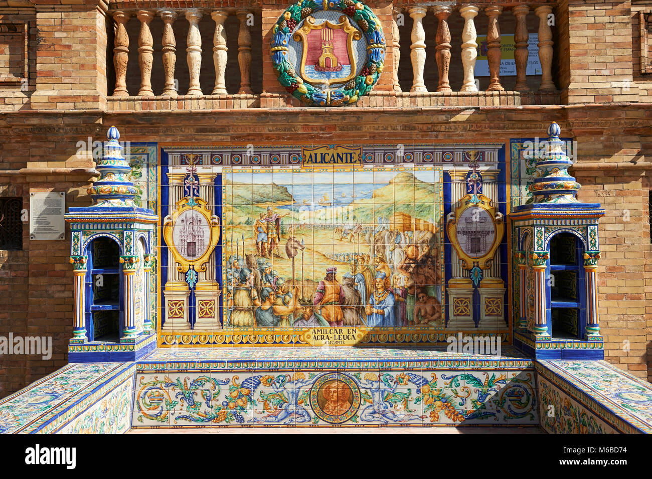 The tiled Alicante Alcove along the walls of the Plaza de Espana in Seville built in 1928 for the Ibero-American Exposition of 1929, Seville Spain Stock Photo