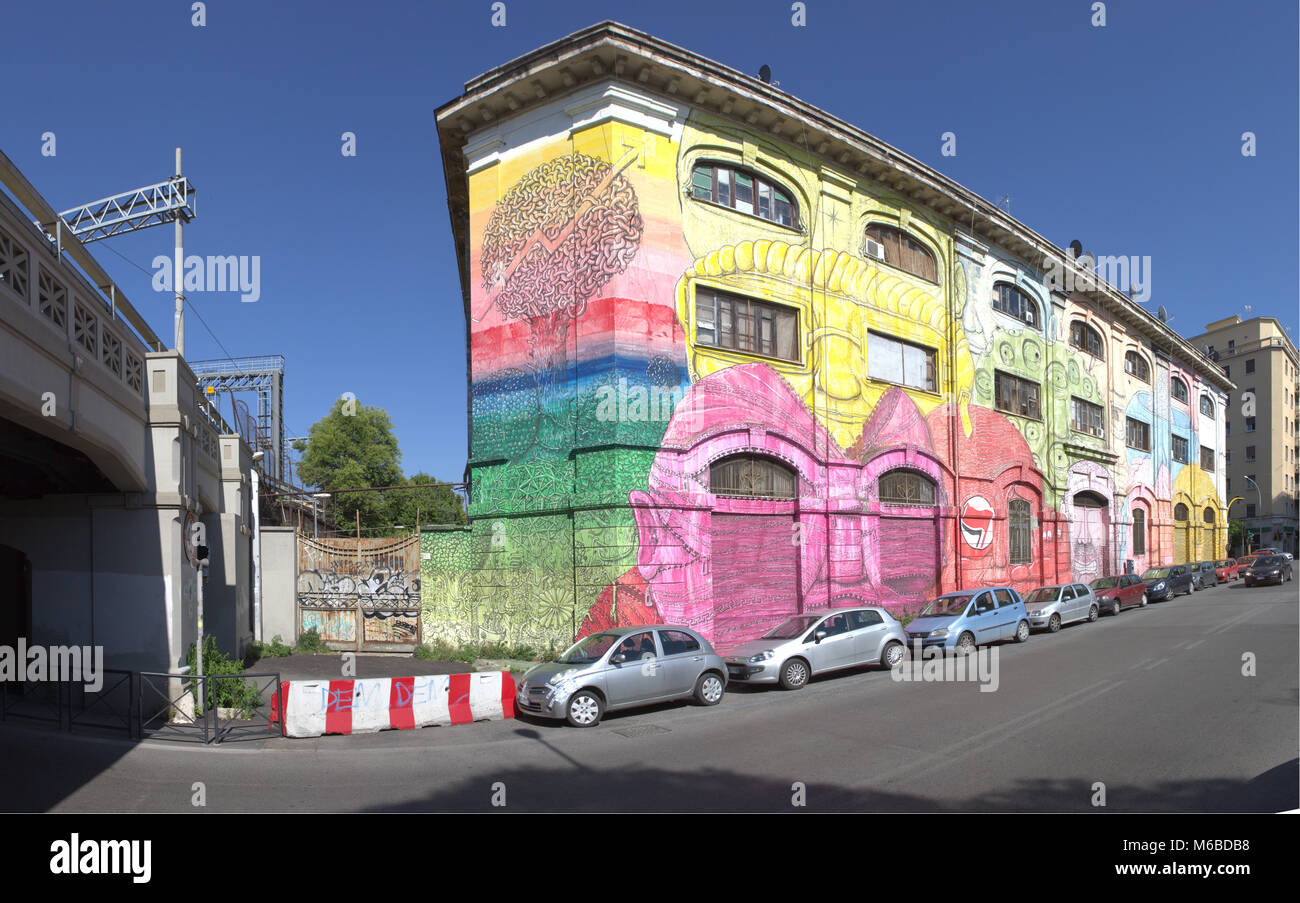 Graffiti covered block of houses in Ostiensa district in Rome Stock Photo