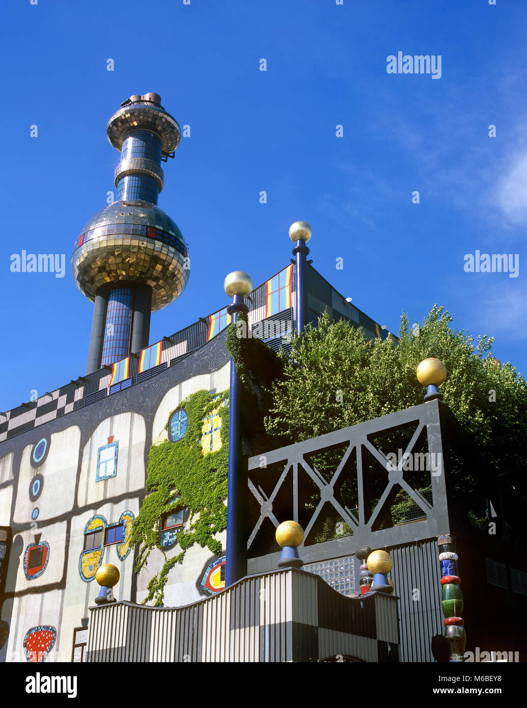 The Spittelau waste incinerator, Vienna, Austria. The building's exterior was designed by the artist and designer Friedensreich Hundertwasser. Stock Photo