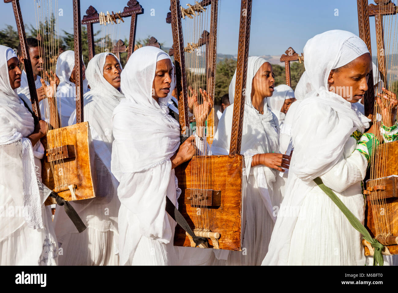 A Procession Of Female Ethiopian Christians Carrying Begenas Arrive At ...