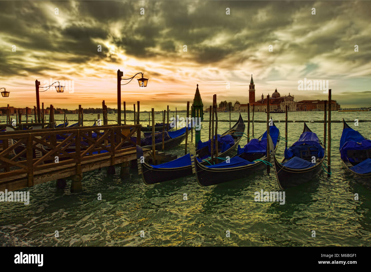 dramatic view of Venice city gondola at sunset Stock Photo - Alamy