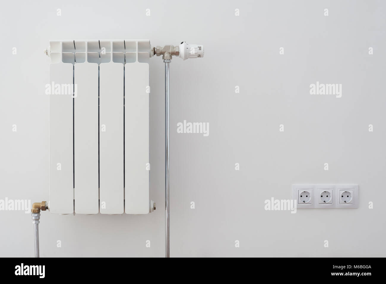 Home radiator heater on white wall. Warming equipment for apartment Stock Photo Alamy