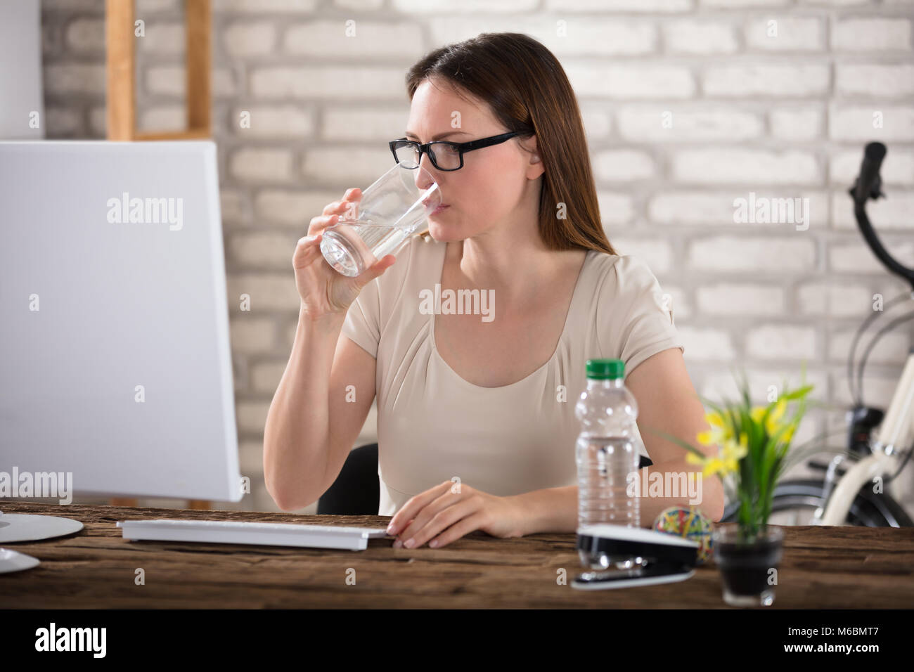 Man With Glasses Using Computer Person using keyboard glass water hi-res stock photography and images ...