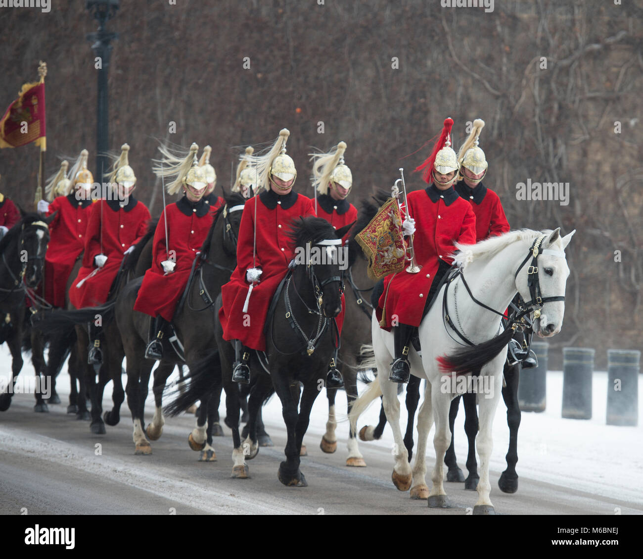 1 March 2018. Life Guards ride through wind blown snow to attend Changing the Guard ceremony at Horse Guards Parade, London, UK. Stock Photo