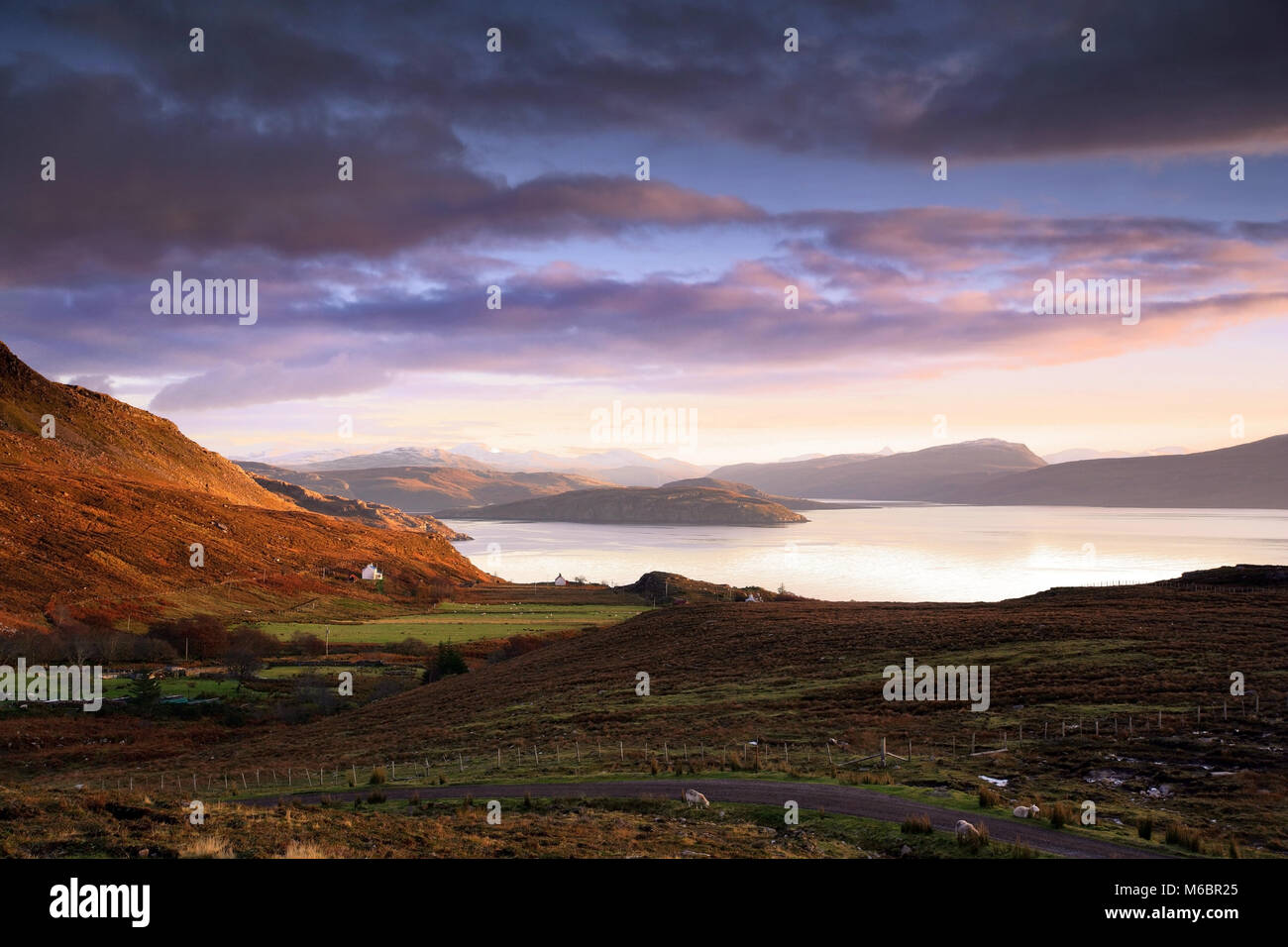A winter view across the Wester Ross coast looking towards Loch Broom as the sun sets. Stock Photo