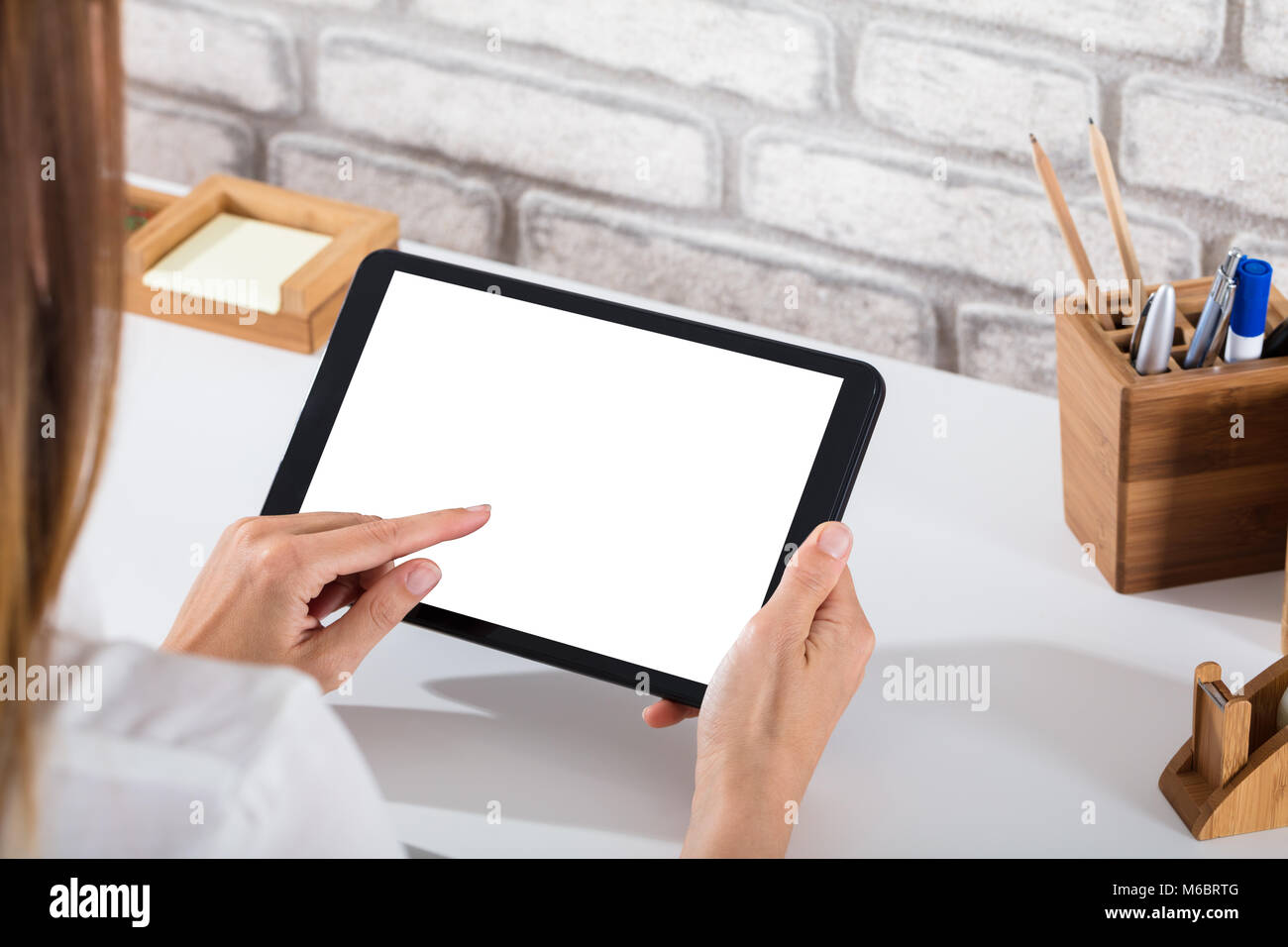 Close-up Of A Person's Hand Using Digital Tablet With Blank White ...