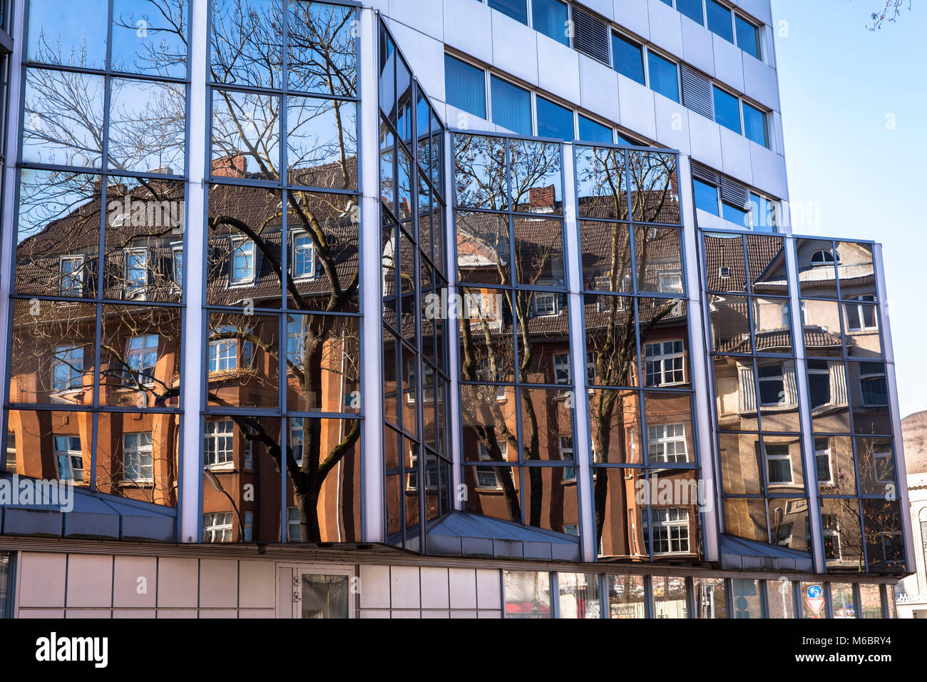 Germany, Cologne, old buildings in the Neuhoeffer street are reflected in the facade of the building of the Landschaftsverband Rheinland in the distri Stock Photo