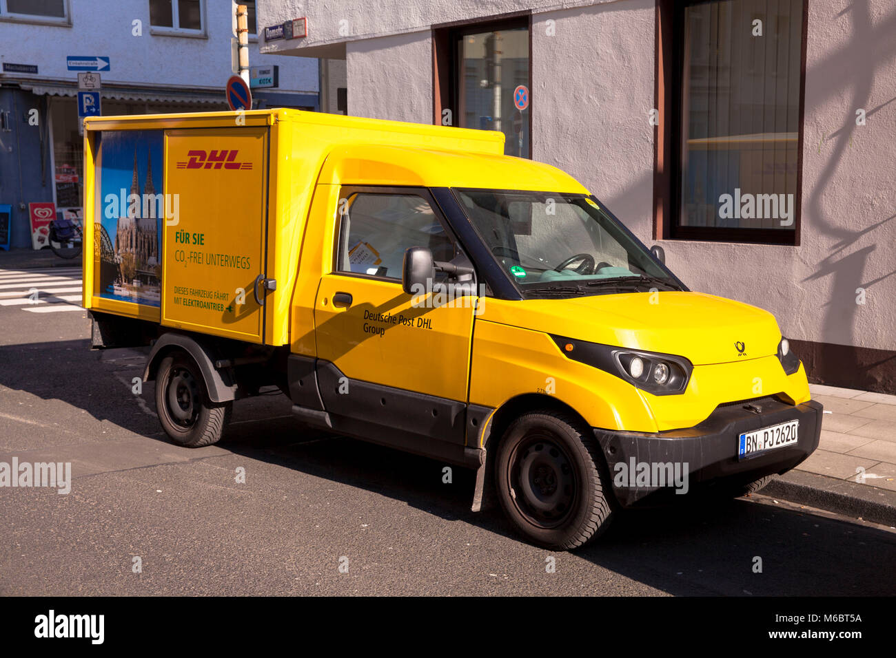 Germany, Cologne, DHL parcel service electric vehicle Streetscooter.  Deutschland, Koeln, DHL- Elektrofahrzeug Streetscooter. Stock Photo