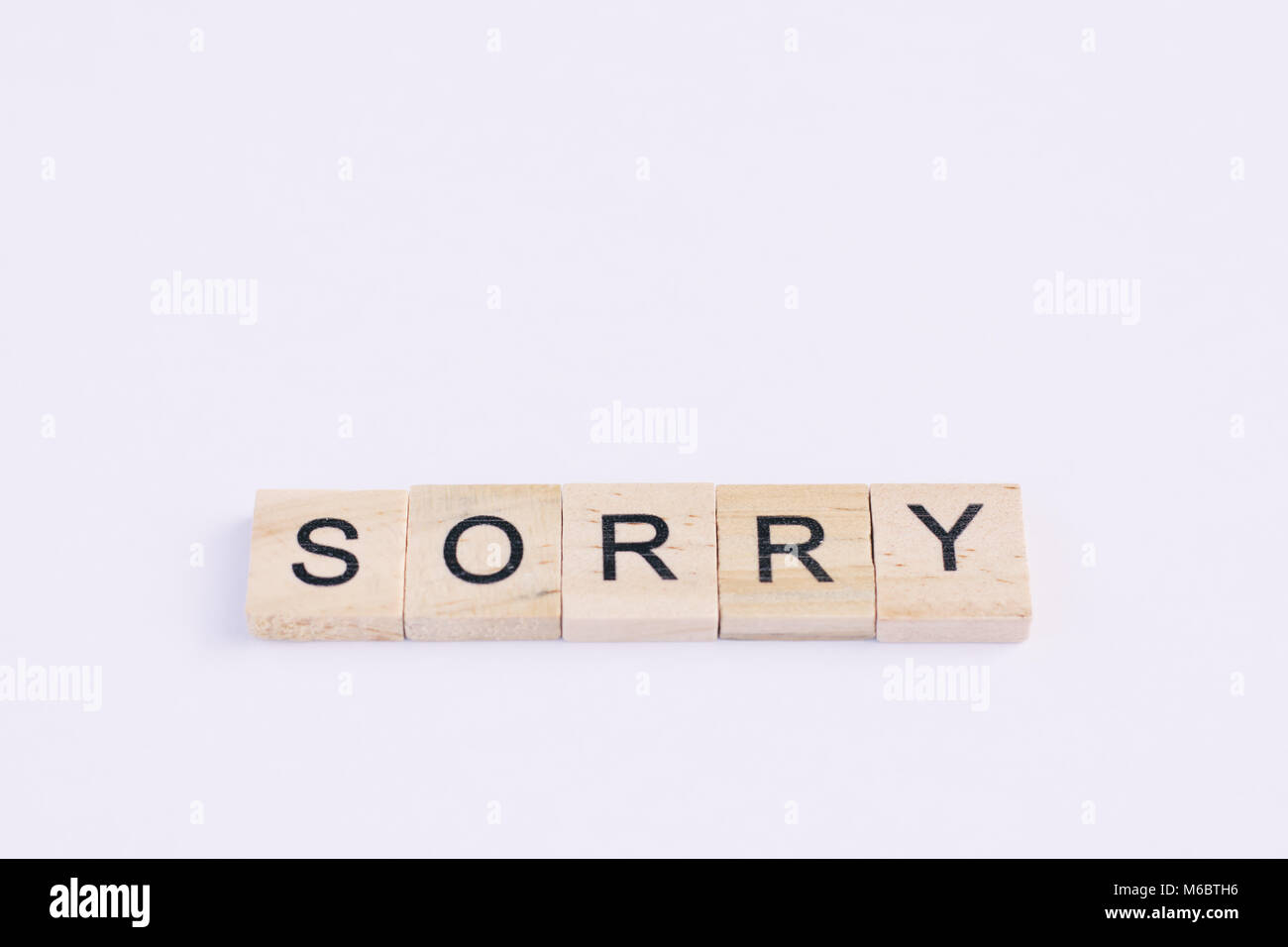 Sorry Block Text wooden blocks spelling the word sorry on white background Stock ...