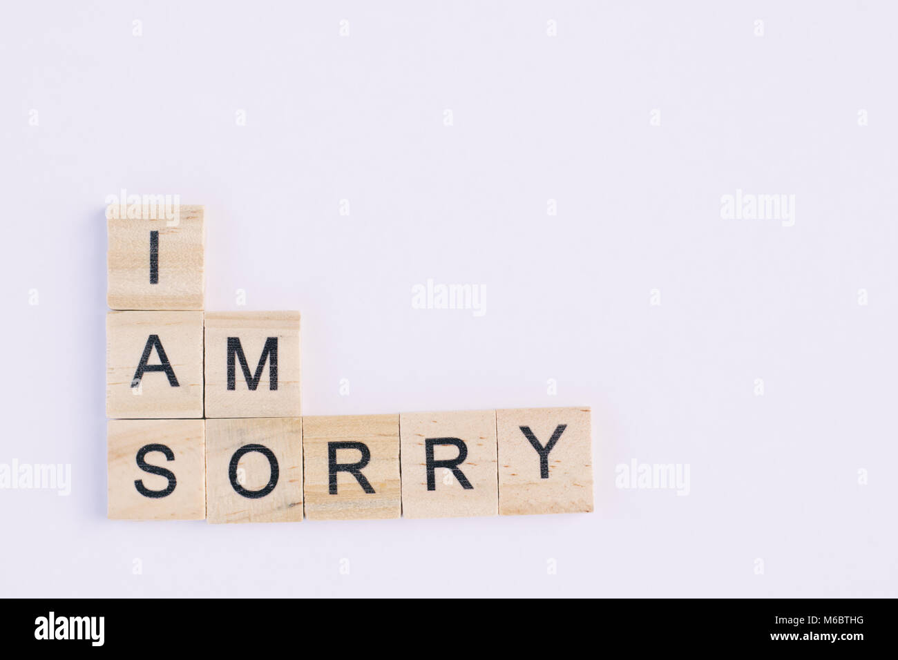 Sorry Block Text wooden blocks spelling the word i am sorry on white background ...