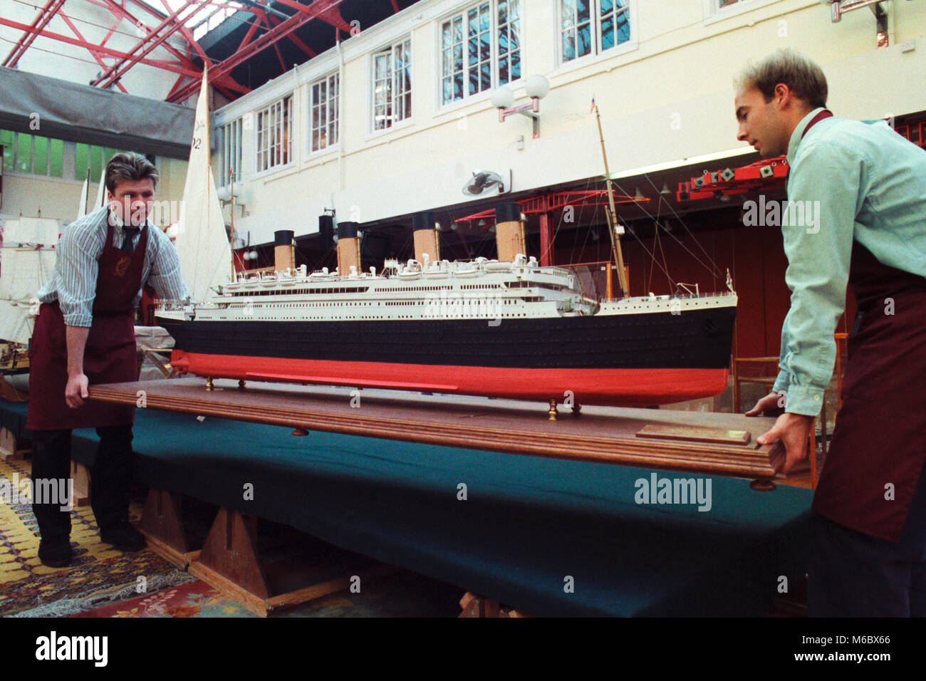 A model of the White Star liner RMS Titanic being installed at Christie's in London for an auction of maritime memorabilia, models and pictures. Stock Photo