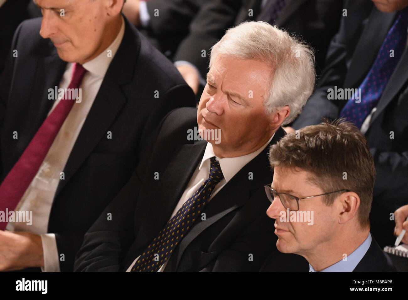 (left to right) Chancellor Philip Hammond, Brexit Secretary David Davis and Business Secretary Greg Clark listen to a speech by Prime Minister Theresa May at the Mansion House in London on the UK's economic partnership with the EU after Brexit. Stock Photo
