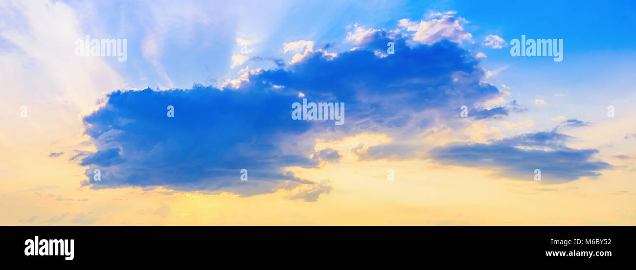 Scenic cumulus clouds in sunset sky. Panorama shot Stock Photo - Alamy