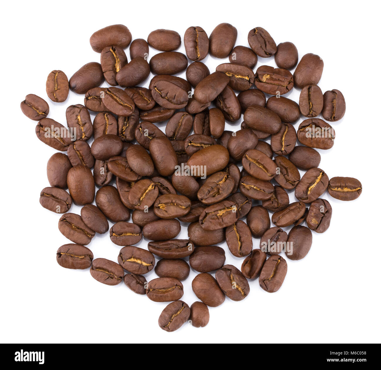 Roasted coffee beans pile from top isolated on white background with ...