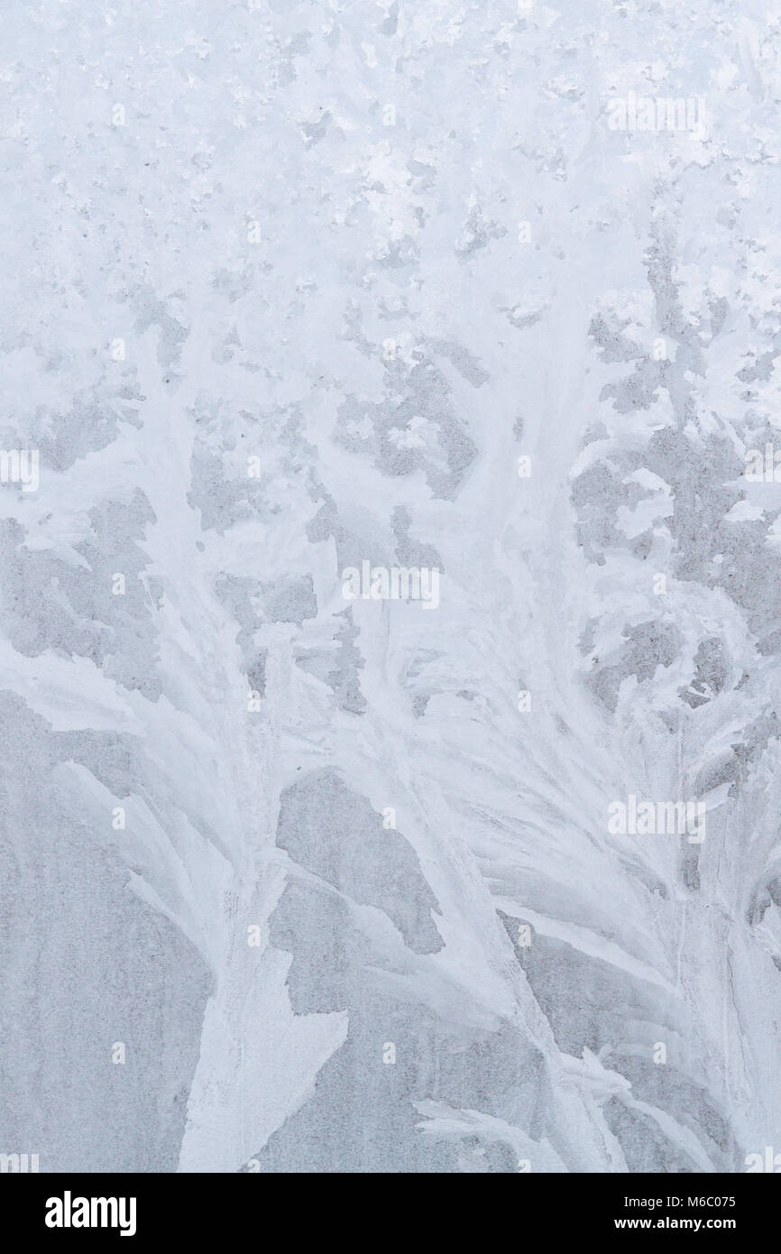 Winter frosty patterns on the frozen ice window Stock Photo - Alamy