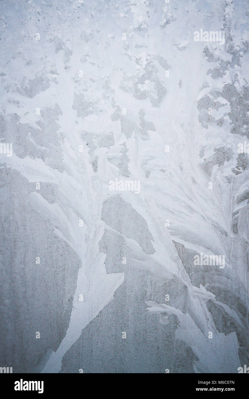 Winter frosty patterns on the frozen ice window Stock Photo - Alamy
