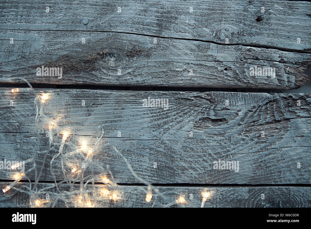 Light bulbs on light and old wooden background Stock Photo