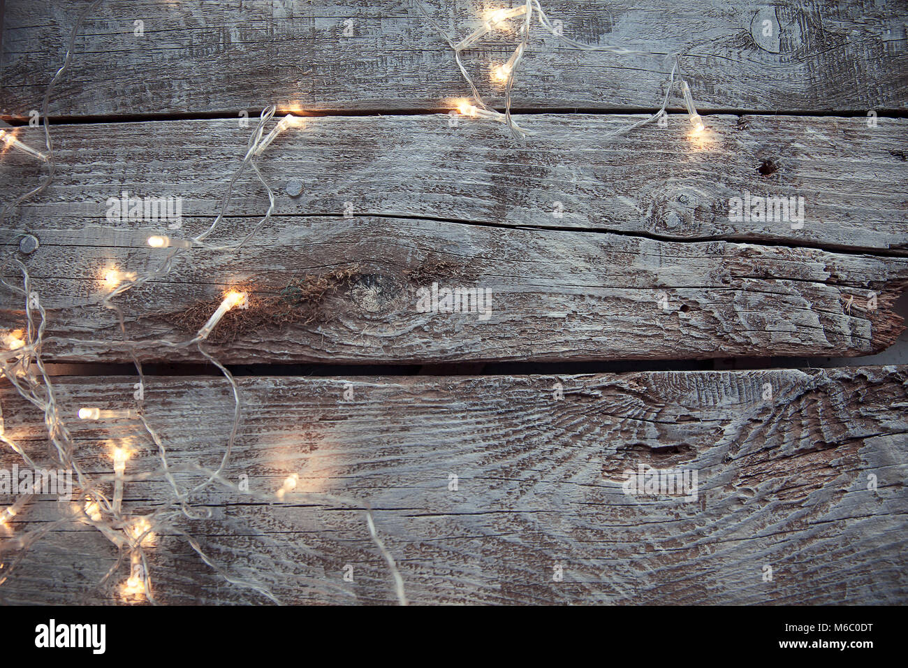 Light bulbs on light and old wooden background Stock Photo