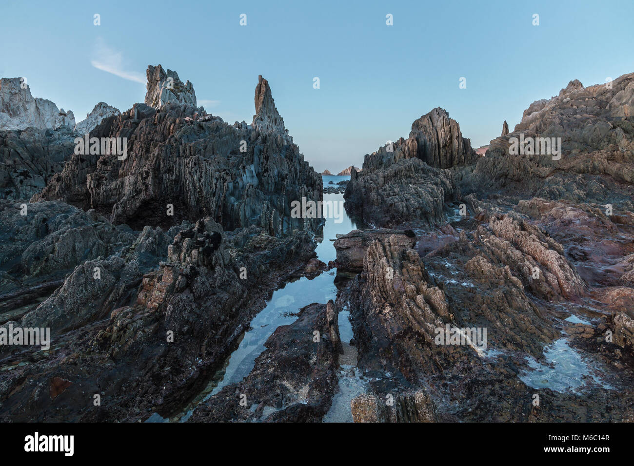 the beach of Gueirua, a disturbing landscape of sharp rocks that emerge ...