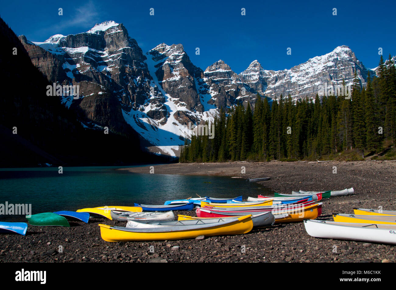 Wenkchemna Peaks with Moraine Lake canoes, Banff National Park, Alberta, Canada Stock Photo