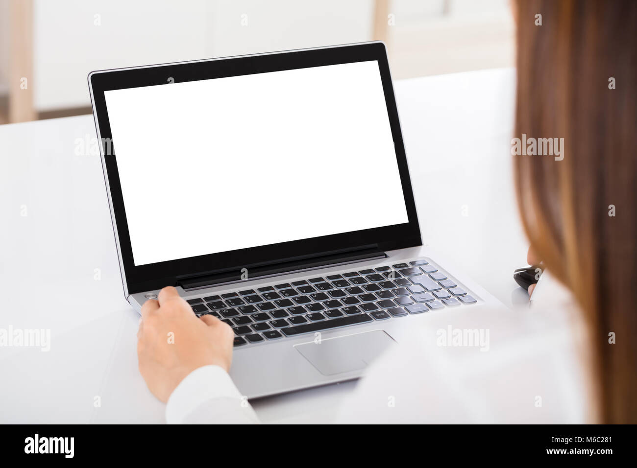 Close-up Of A Businesswoman Working On Laptop With Blank White Screen ...