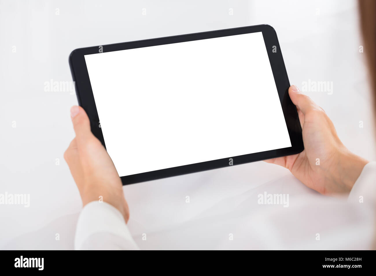 Human Hand Holding Digital Tablet With Blank White Screen Stock Photo ...