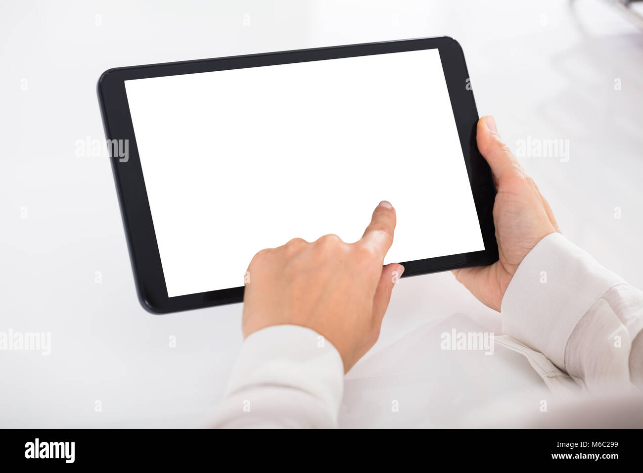 Human Hand Holding Digital Tablet With Blank White Screen Stock Photo ...