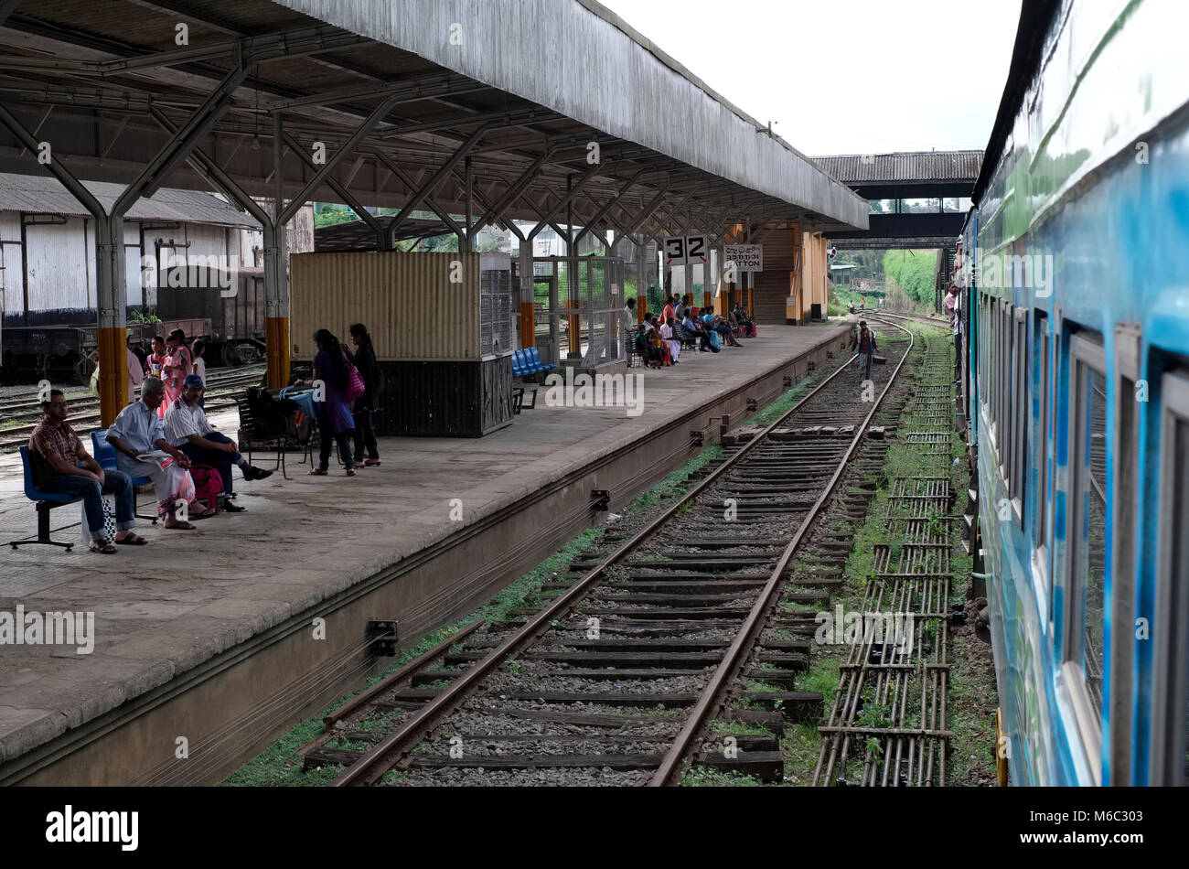 People wait on the railway platform at Hatton station in the Badulla district of Sri Lanka Stock Photo