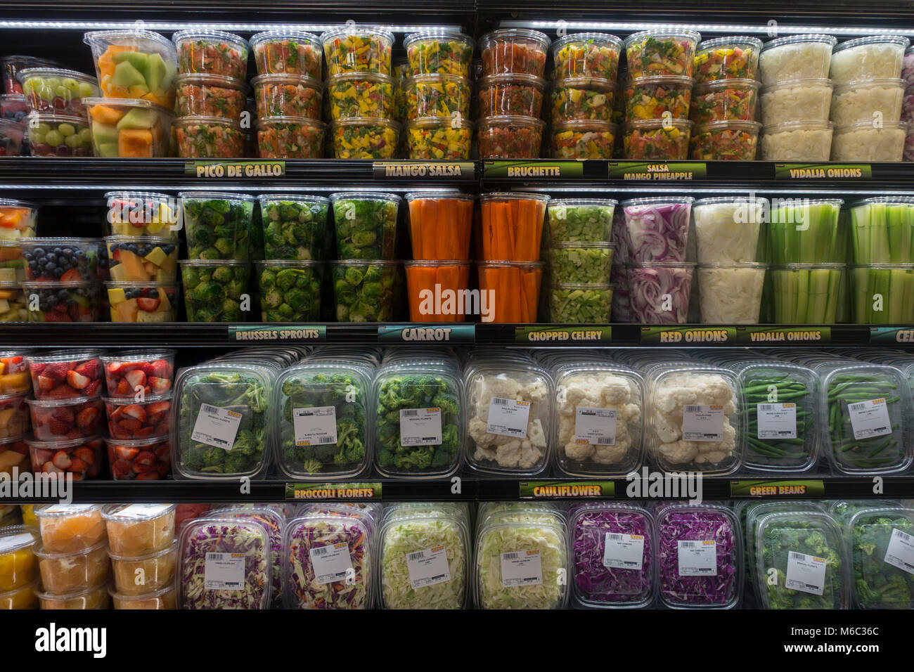 pre cut fruit and vegetables in grocery store Brooklyn NYC Stock Photo