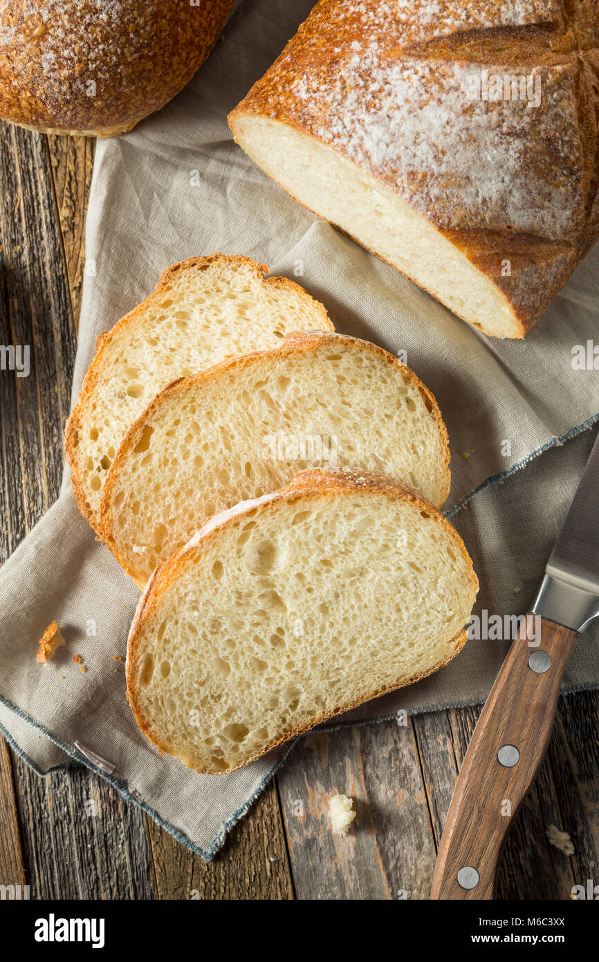 Whole Grain White French Bread Cut into Slices Stock Photo