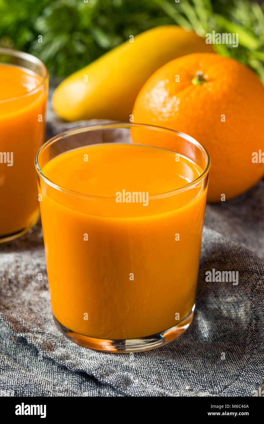 Healthy Organic Orange Carrot Smoothie Juice Drink with Mango and Banana Stock Photo