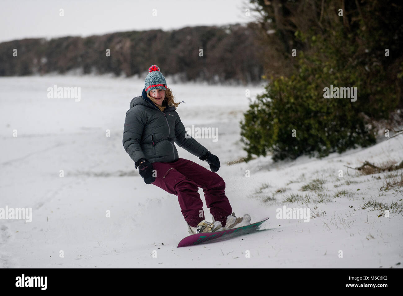 A female snowboarder makes the most of conditions on Solsbury Hill near ...