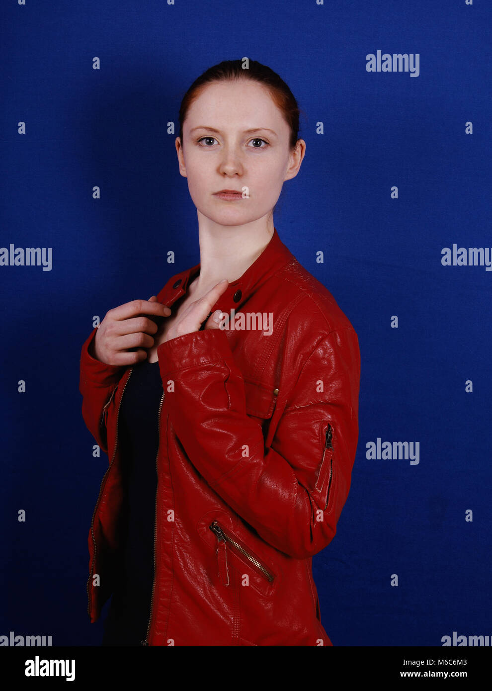 young woman wearing retro fashion red leather jacket Stock Photo
