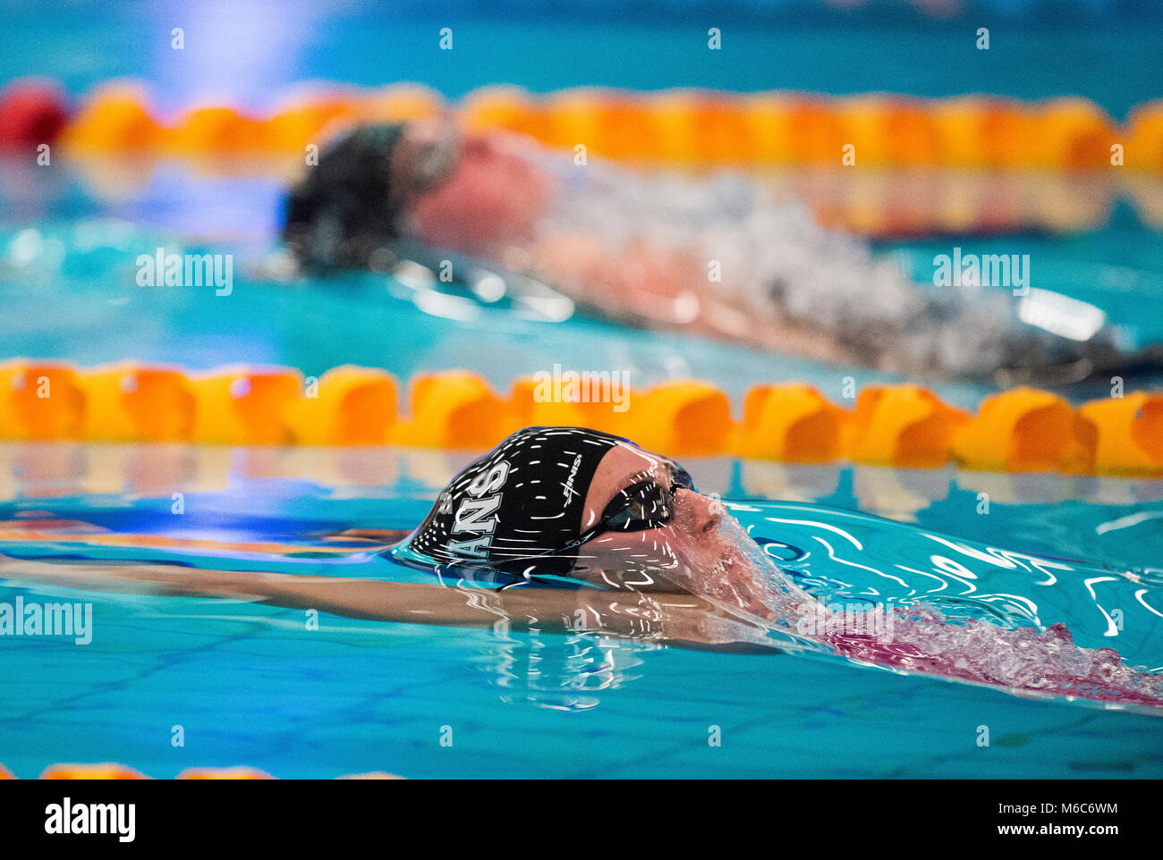 Cassie Wild swimming in a 50m backstroke skins event during day one of